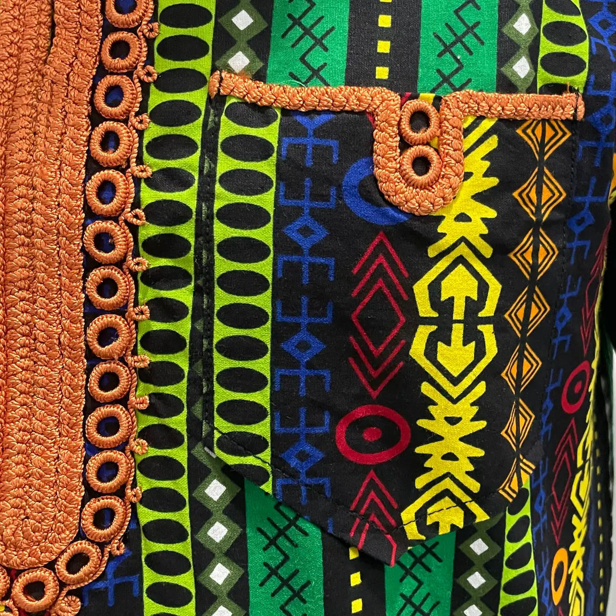 Image of the embroidery design on the pocket of the Ankara shirt