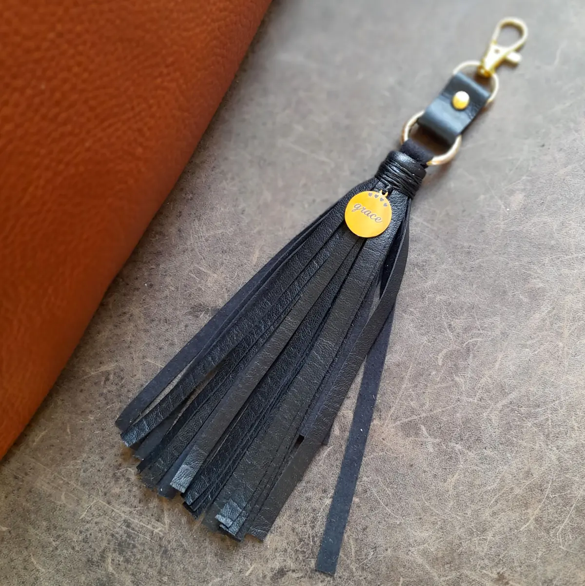 Handmade Leather Tassel Bag Charm with Gold Stainless Steel Grace Pendant