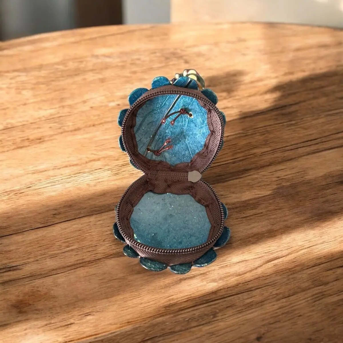 Inside view of a blue wooden handmade coin purse for kids