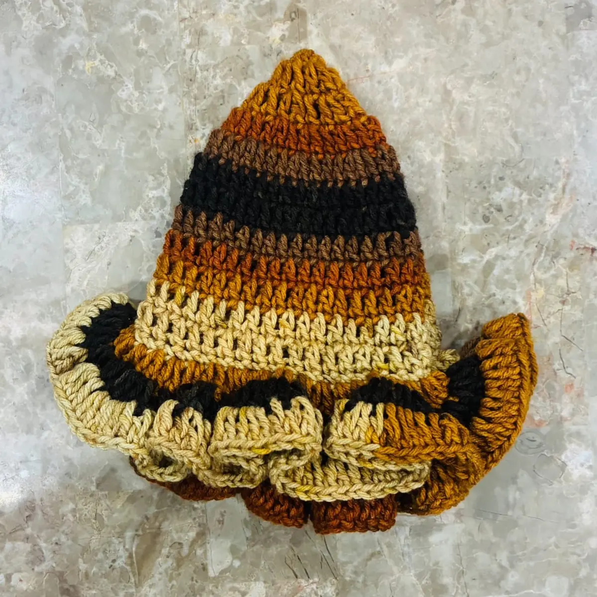 A handmade multi-tone brown crochet hat for women
