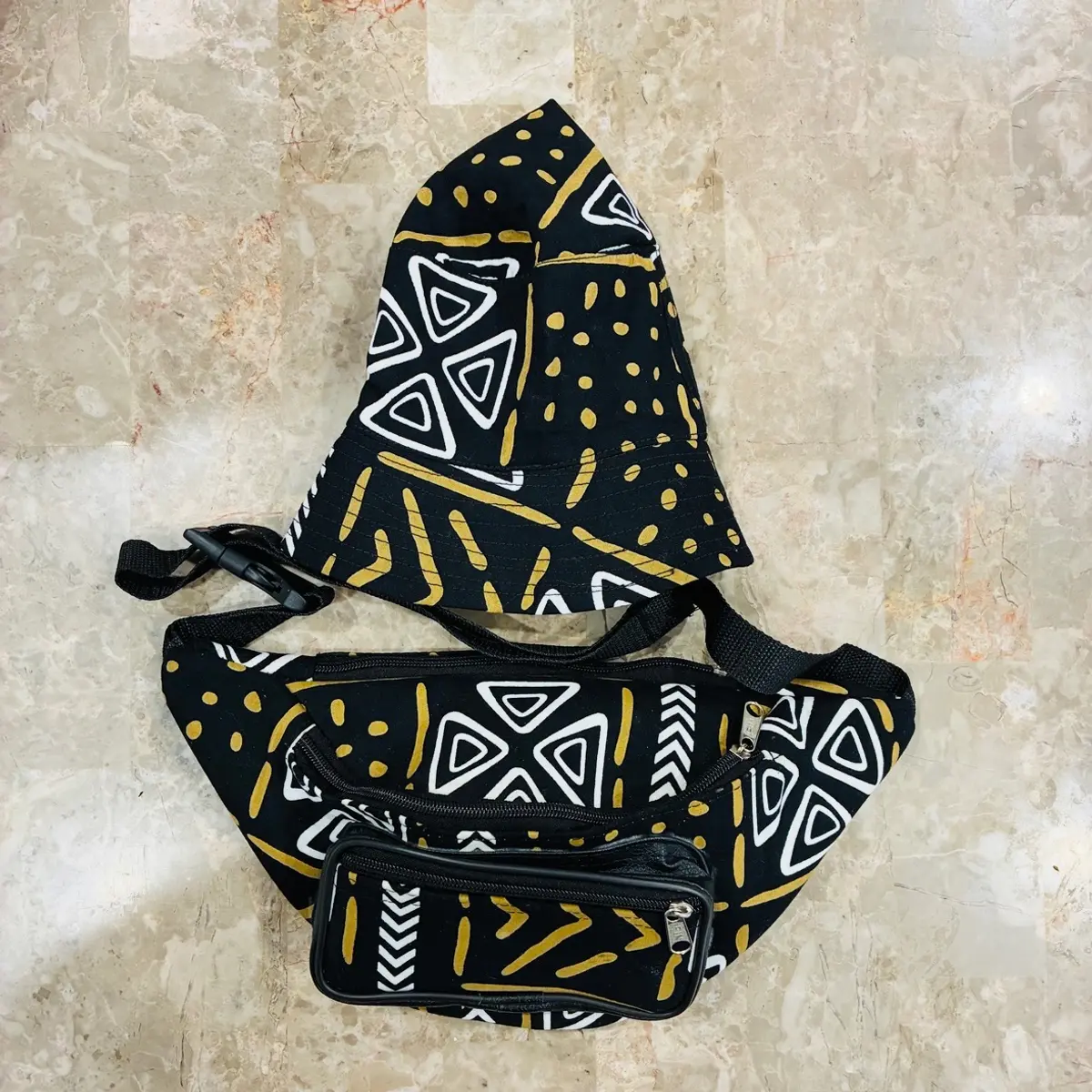 A view of both handmade matching african print bucket hat and fanny pack
