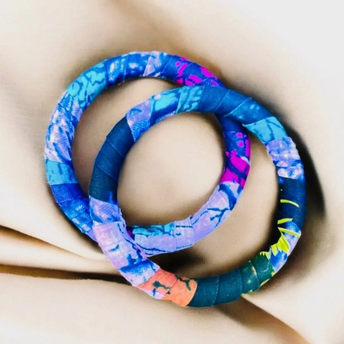 A pair of handmade multi-coloured bangle bracelets for women