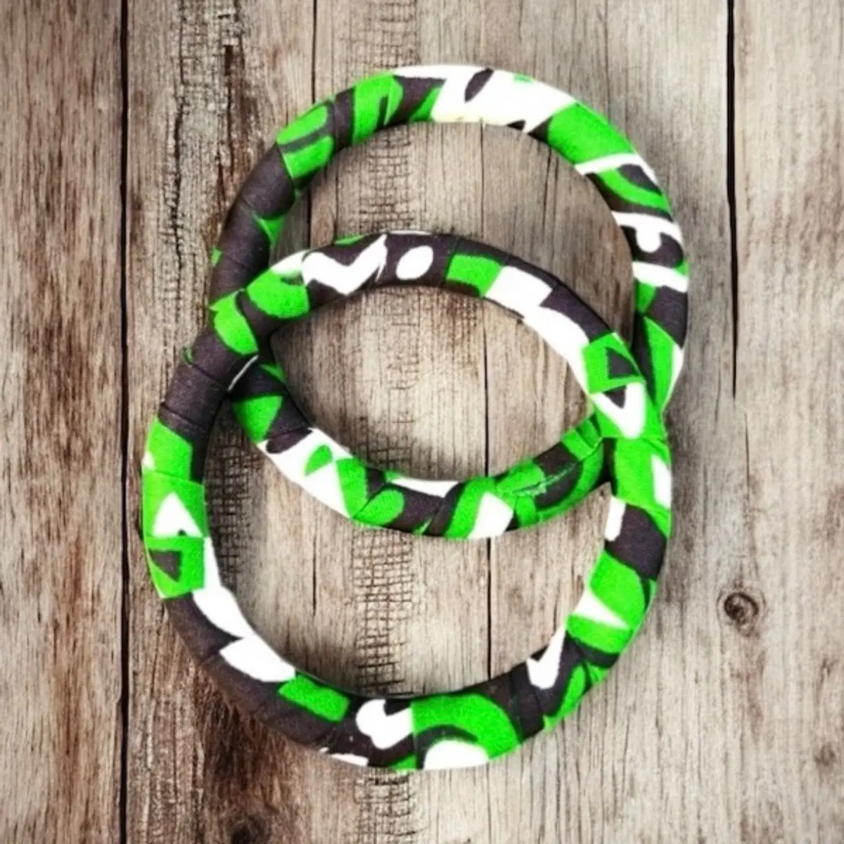 A set of green/white/black handmade bracelets for women