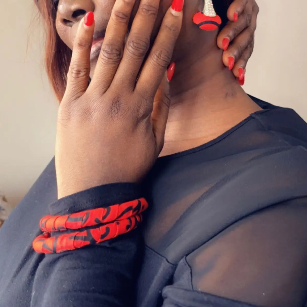 Woman show casing Ankara bracelet