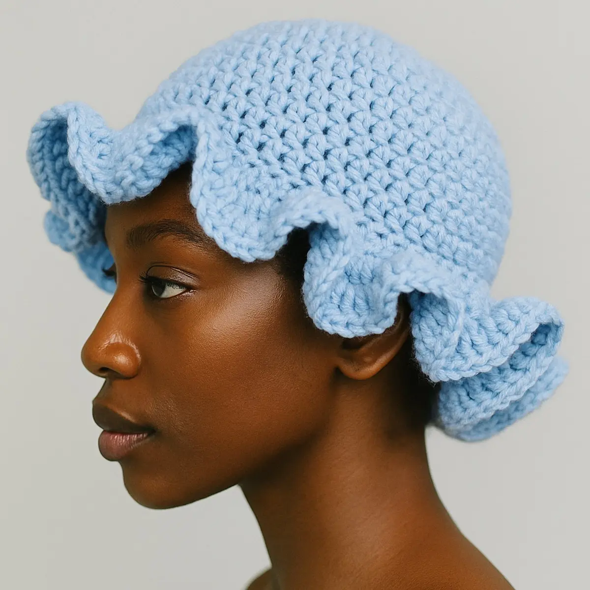 Sideview of light blue handmade crochet hat