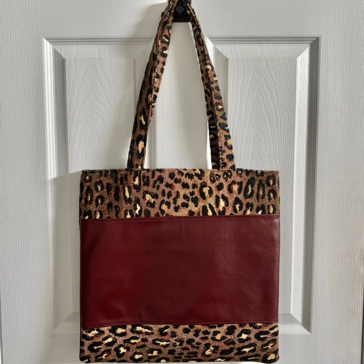 The back of the faux leather leopard print tote bag