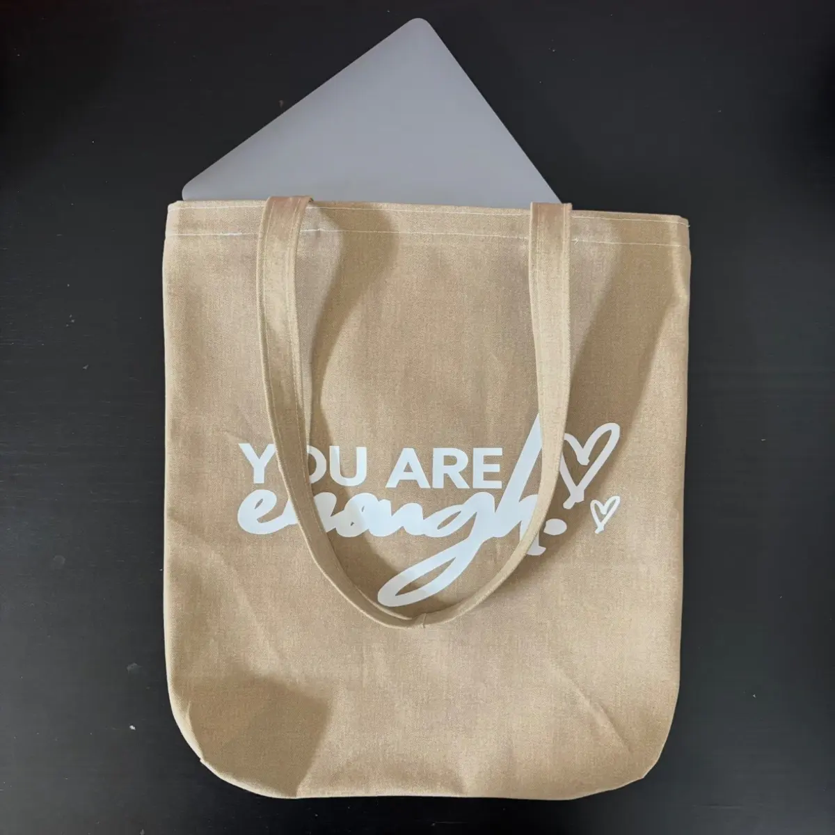 Showcasing items fitting in an affirmation tote bag