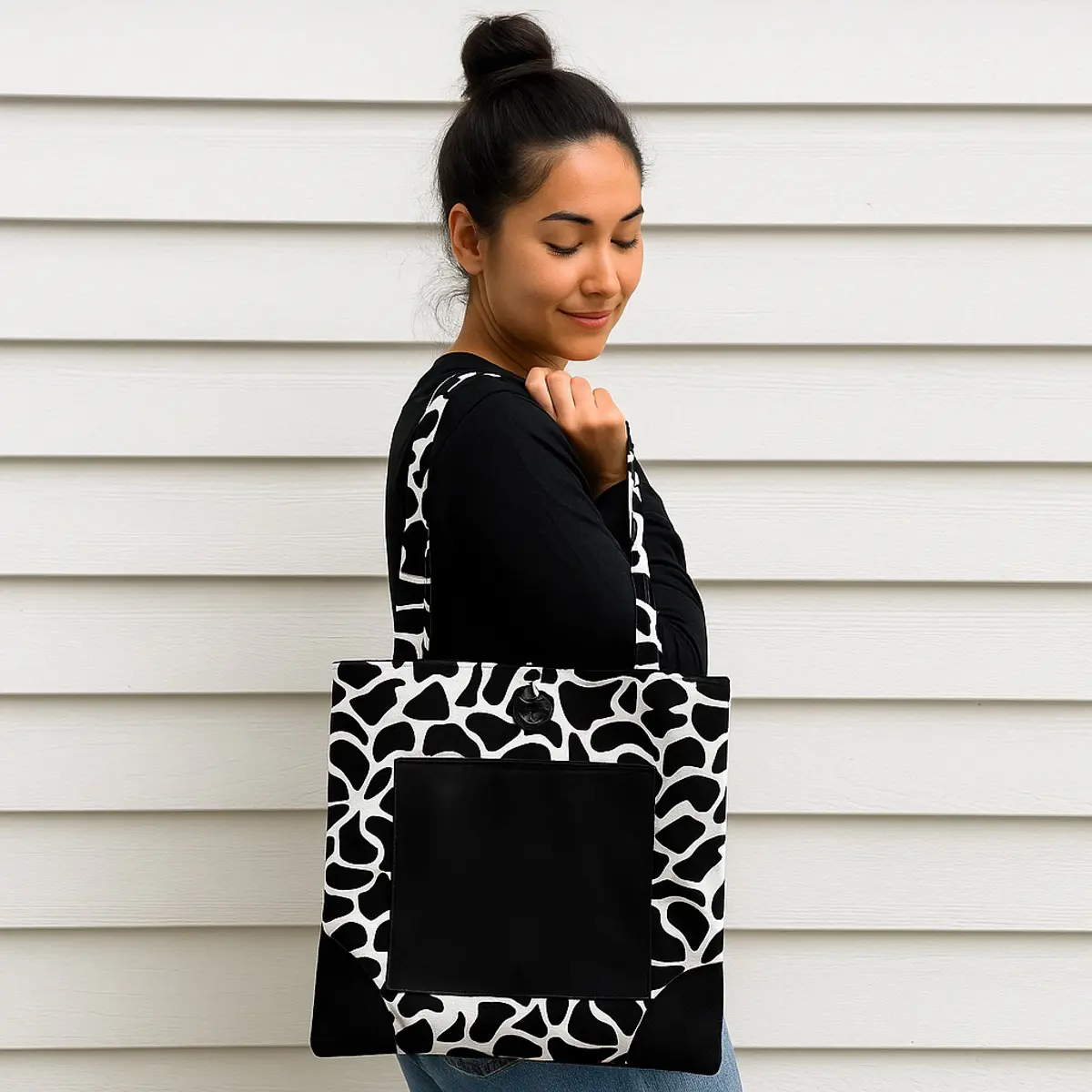 Someone wearing the animal print tote bag