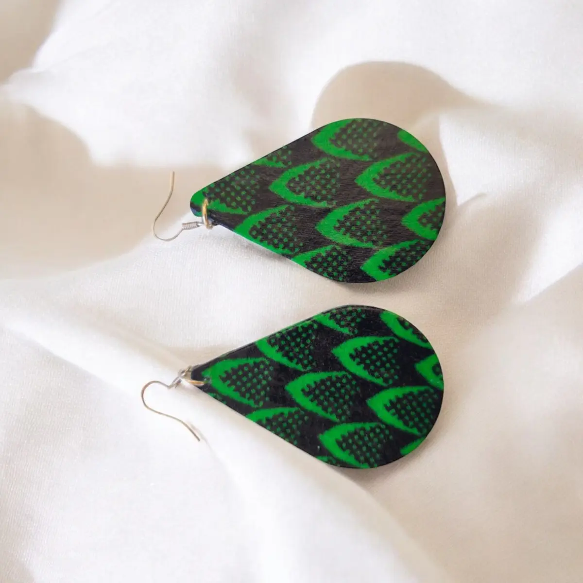 A display of teardrop earrings made from Ankara fabric