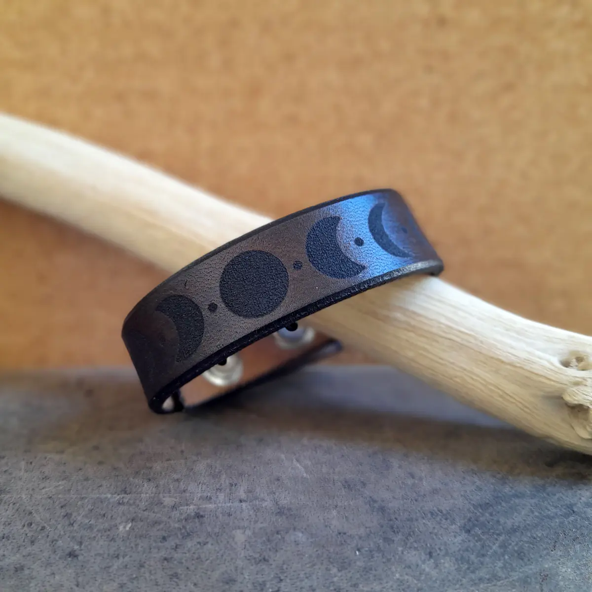 Moon phase leather bracelet close up