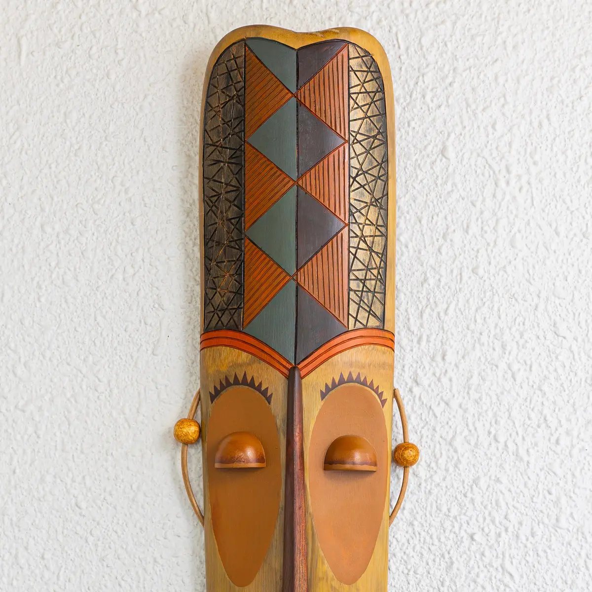 Upper half of a handcrafted and hand painted bamboo art