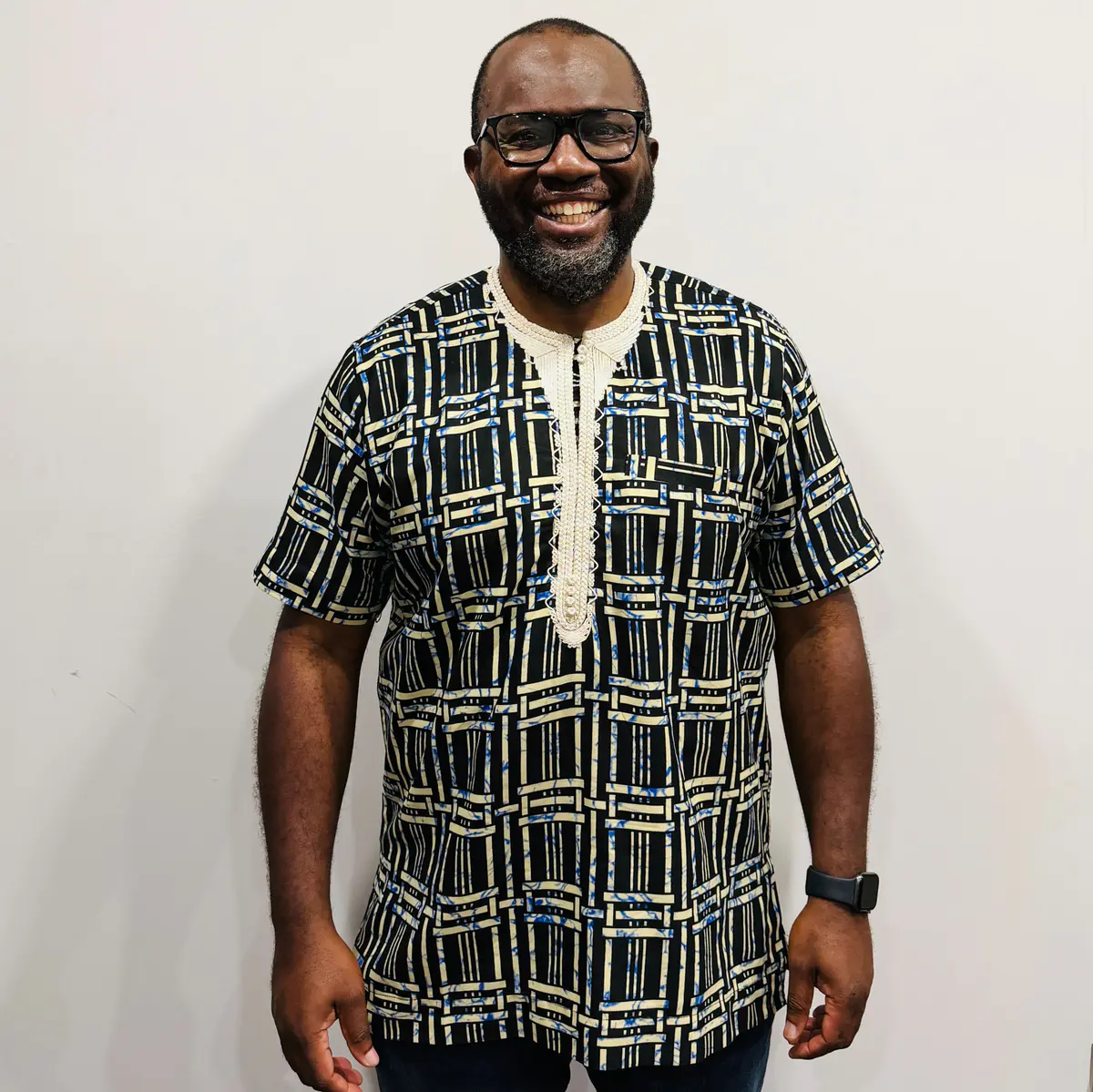 Men’s traditional African shirt featuring bold wax print and front pocket
