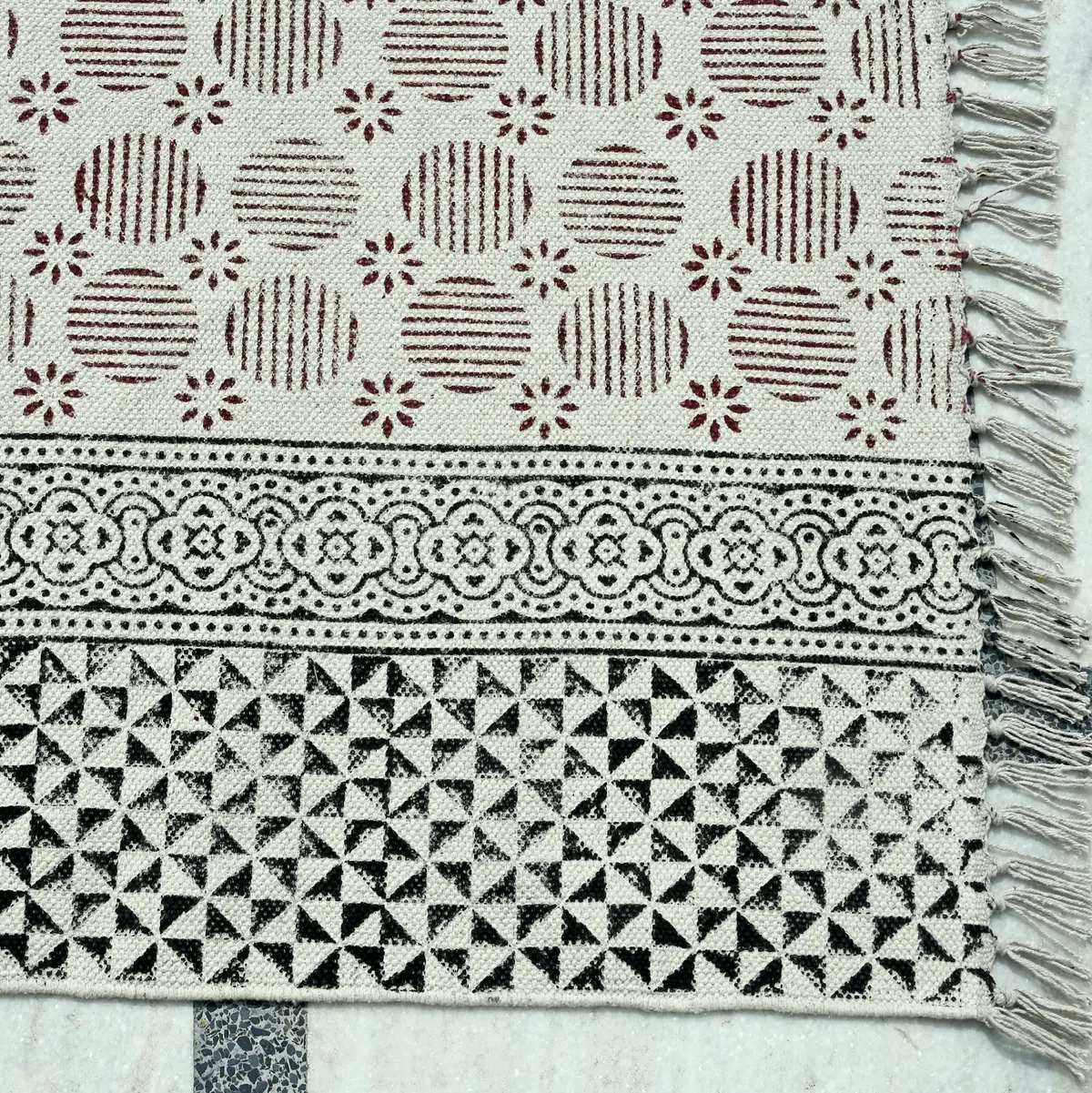 Block printed handmade Indian cotton rug for all block printing lovers. The area rugs are printed using eco-friendly dyes in traditional designs from India. Our handmade block print cotton rugs are skin friendly and manufactured using long lasting cotton fabric. With a neutral color and fashion forward patterns, these are pieces you can build a room around. This boho inspired cotton rug has a smooth finish, created by stamping wooden blocks onto the surface. Available from us at a remarkably affordable price, you can use it to decorate your Living Room, Bedroom, Office, Kitchen, Kids Area, Hallway, Entryway, Bathroom, and many more spaces.