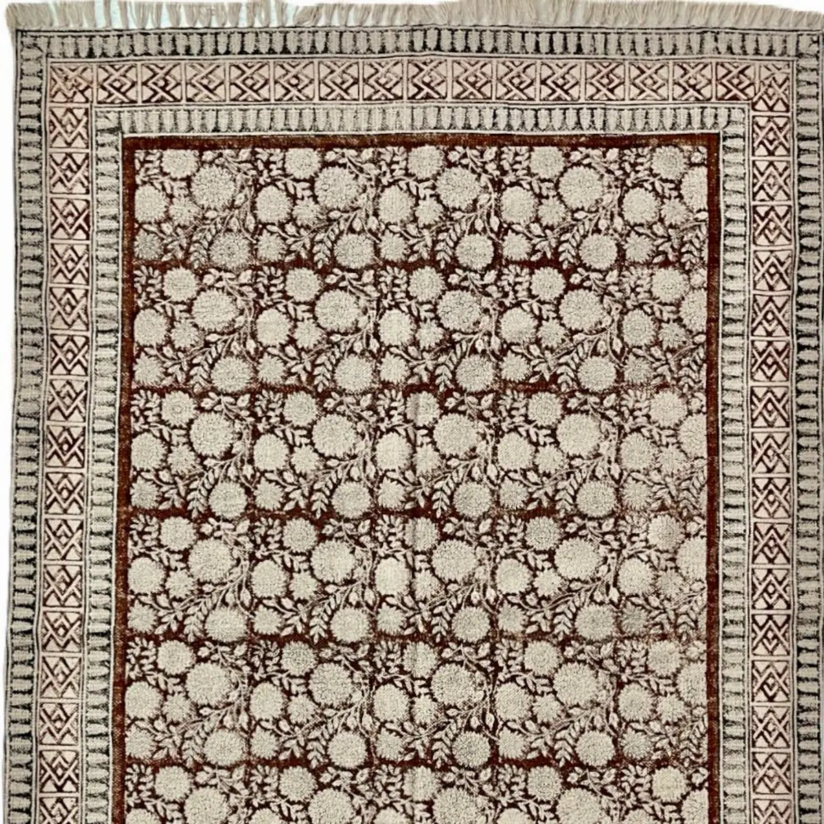 Shop handmade Indian cotton rugs crafted by skilled artisans. Boho, modern & durable area rugs for living rooms and bedrooms.