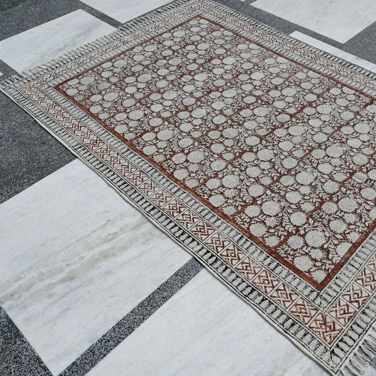 Shop handmade Indian cotton rugs crafted by skilled artisans. Boho, modern & durable area rugs for living rooms and bedrooms.