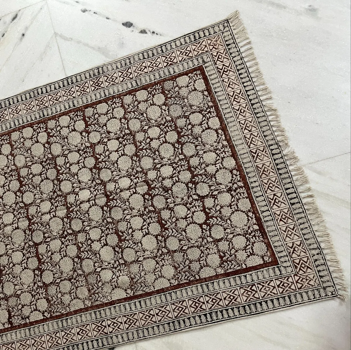 Shop handmade Indian cotton rugs crafted by skilled artisans. Boho, modern & durable area rugs for living rooms and bedrooms.
