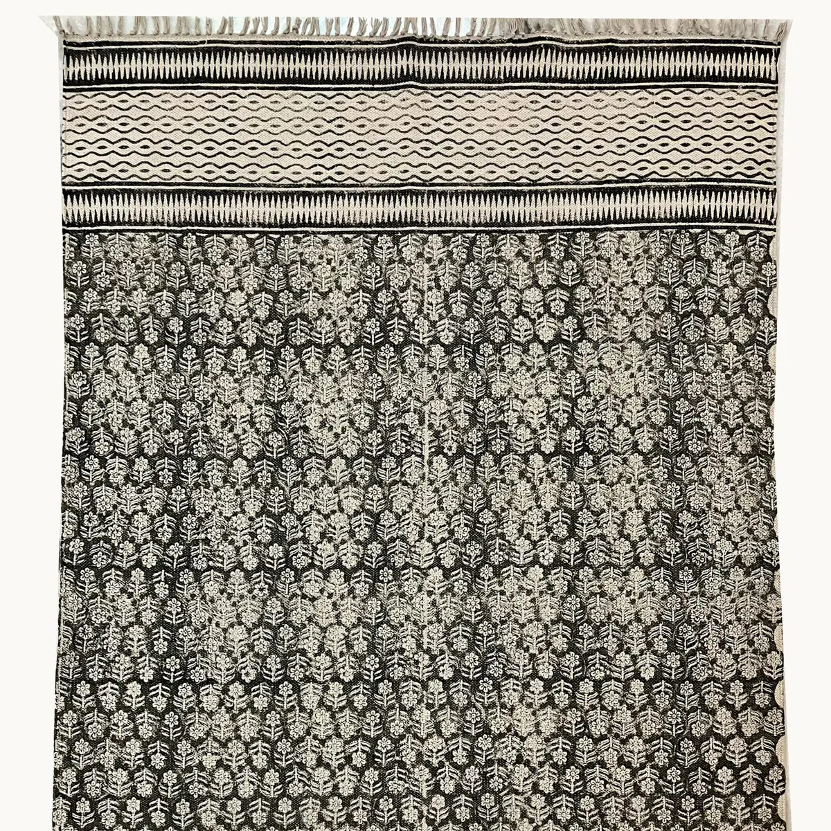 Shop handmade Indian cotton rugs crafted by skilled artisans. Boho, modern & durable area rugs for living rooms and bedrooms.