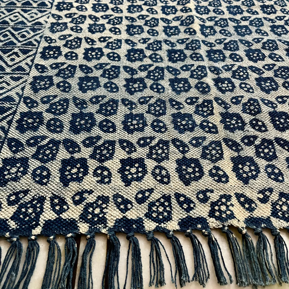 Shop handmade Indian cotton rugs crafted by skilled artisans. Boho, modern & durable area rugs for living rooms and bedrooms.