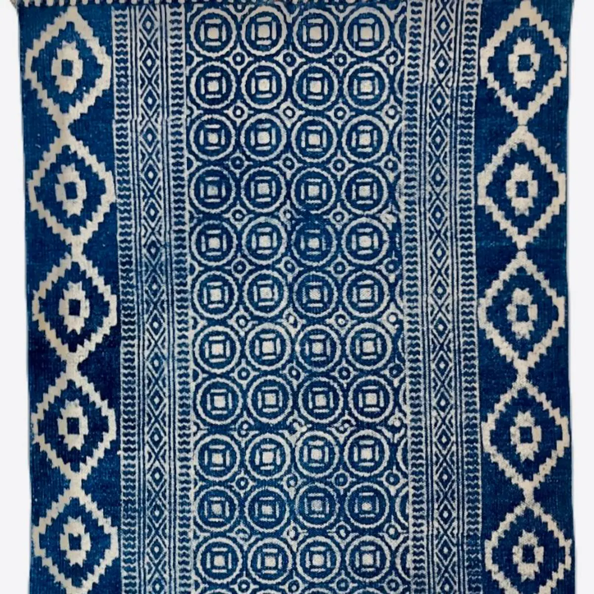 Shop handmade Indian cotton rugs crafted by skilled artisans. Boho, modern & durable area rugs for living rooms and bedrooms.