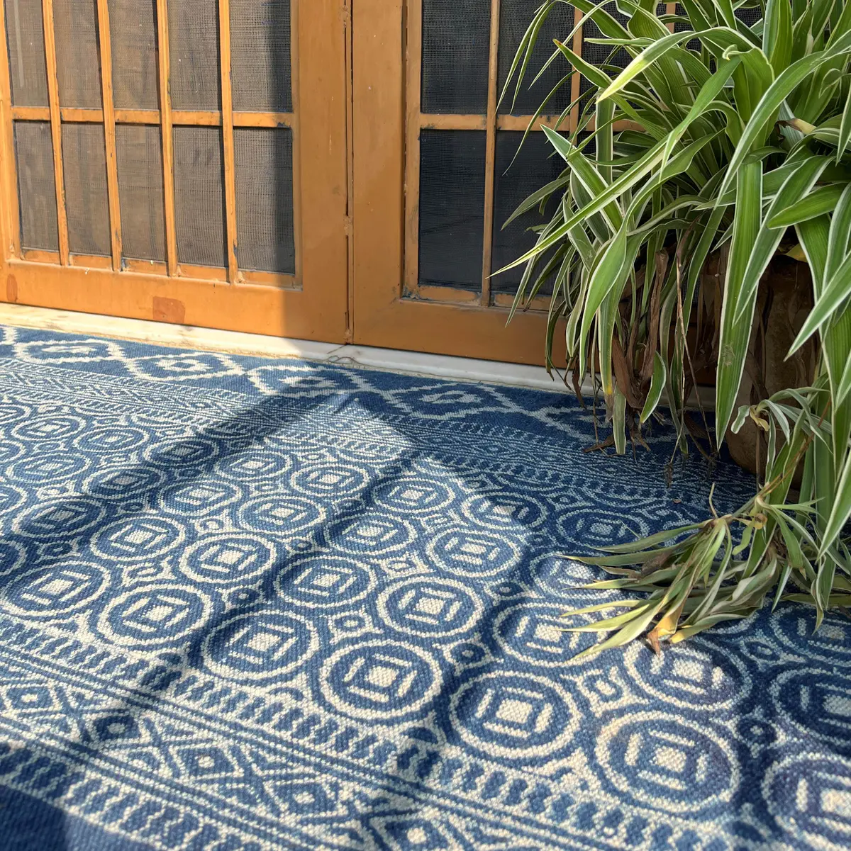 Shop handmade Indian cotton rugs crafted by skilled artisans. Boho, modern & durable area rugs for living rooms and bedrooms.