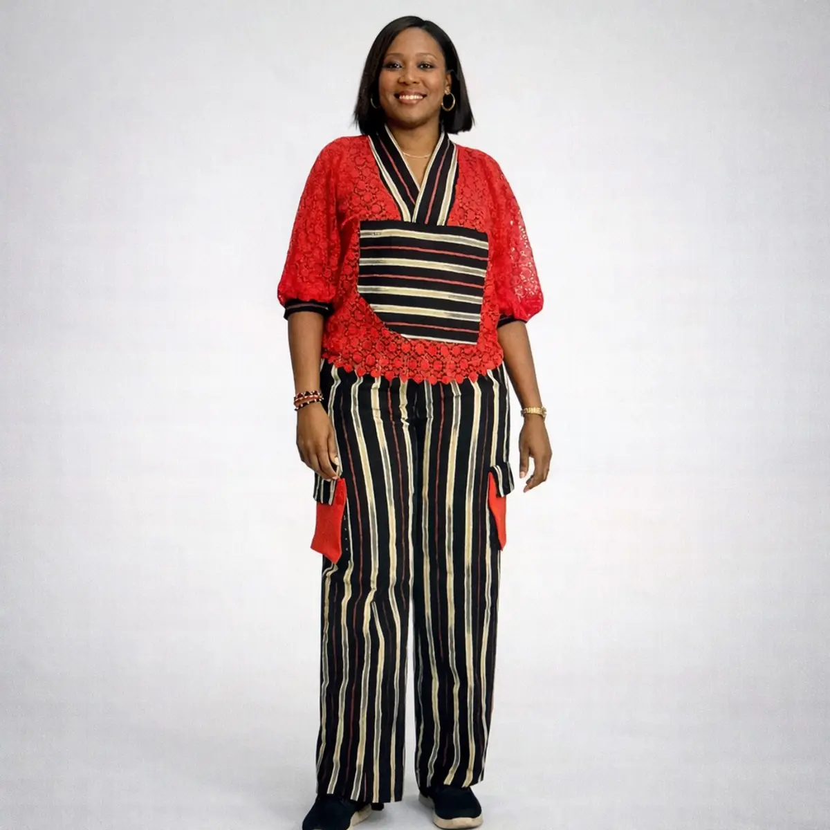 Red and black striped Aso Oke women’s two-piece set with lace top and wide-leg pants