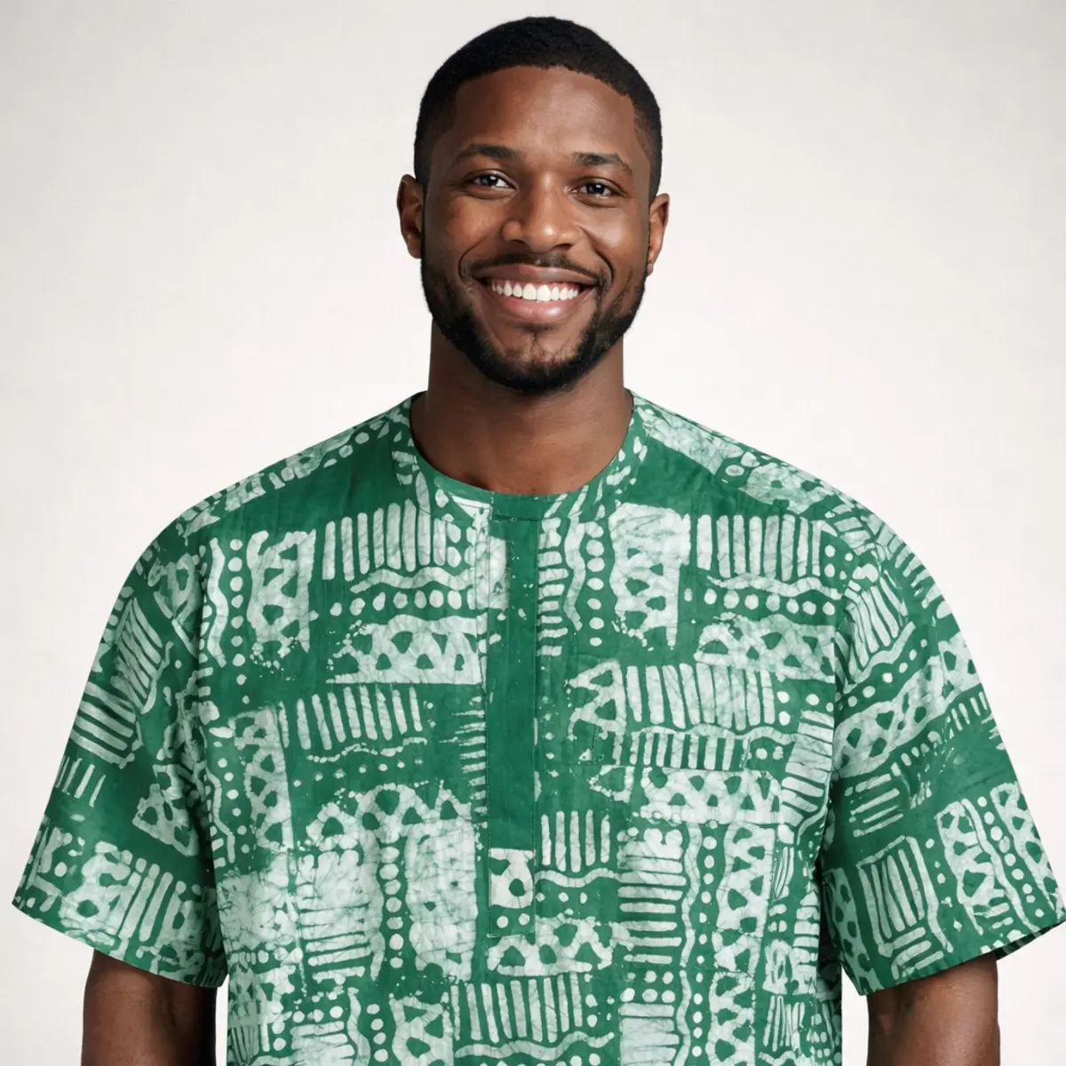 Green Adire short-sleeve top with traditional batik pattern