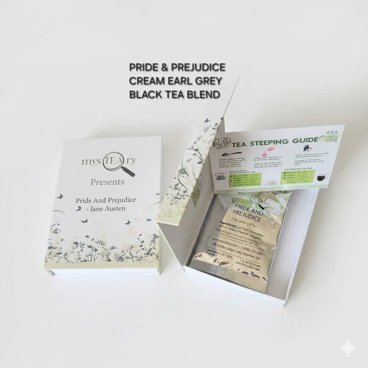 An open white book-style gift box labeled Pride And Prejudice by Jane Austen, branded by mysTEAry, displayed next to its lid which is decorated with botanical illustrations in sage green and cream. Inside the box sits a sealed packet of Pride and Prejudice loose leaf tea alongside a Tea Steeping Guide card. Color: White and Sage Green