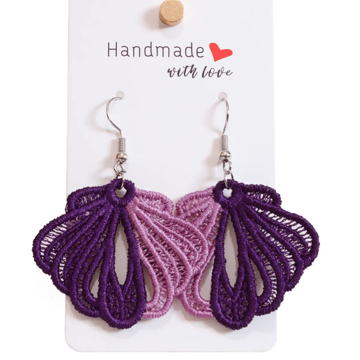 Close front-facing view of handmade two-tone lace butterfly wing earrings on a white display card. The intricate open lacework is clearly visible, showcasing the rich deep purple outer lace paired with a soft lilac-pink inner panel on each earring. Color: Purple and Mauve Pink